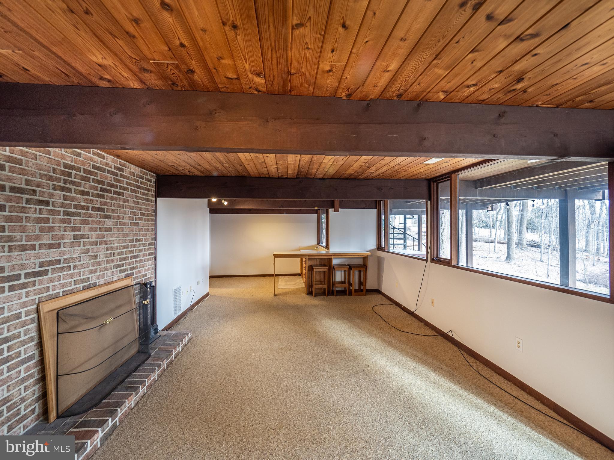 14805 Mockingbird Drive Darnestown, MD 20874 - Photo 24 of 35 a view of a livingroom with a fireplace and window