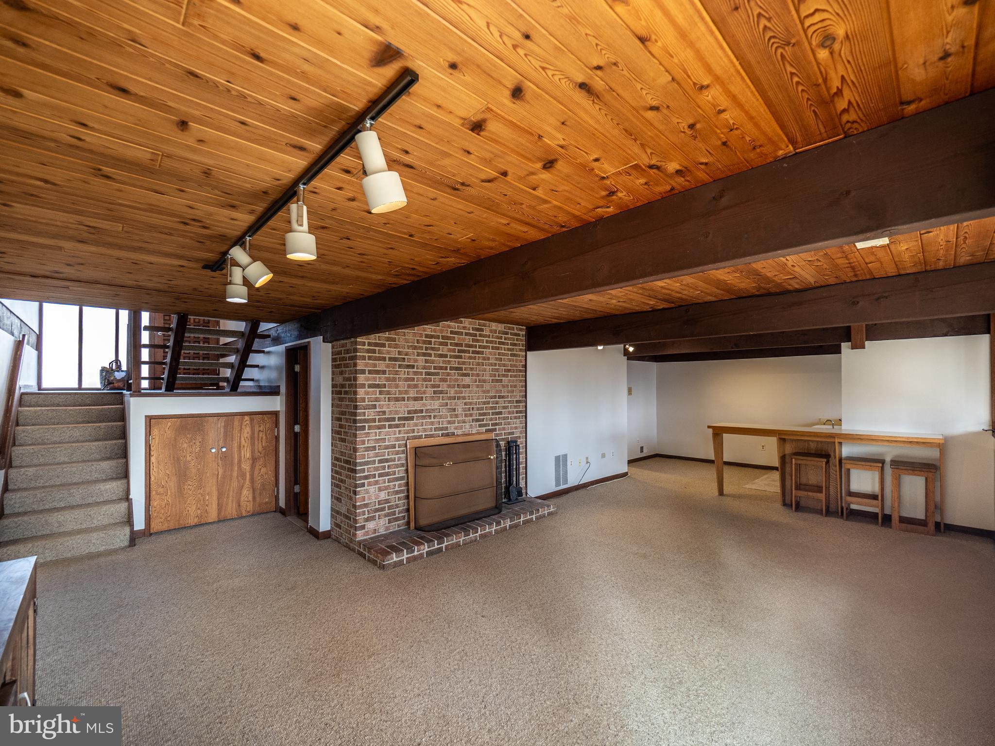 14805 Mockingbird Drive Darnestown, MD 20874 - Photo 25 of 35 a view of a room with fireplace and window
