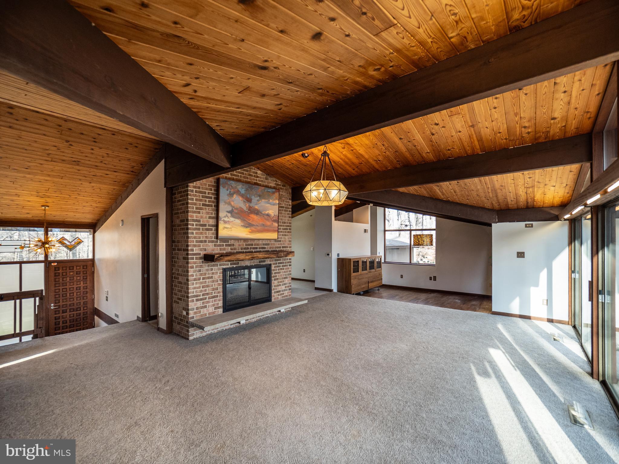 14805 Mockingbird Drive Darnestown, MD 20874 - Photo 4 of 35 a view of a livingroom with furniture and a fireplace