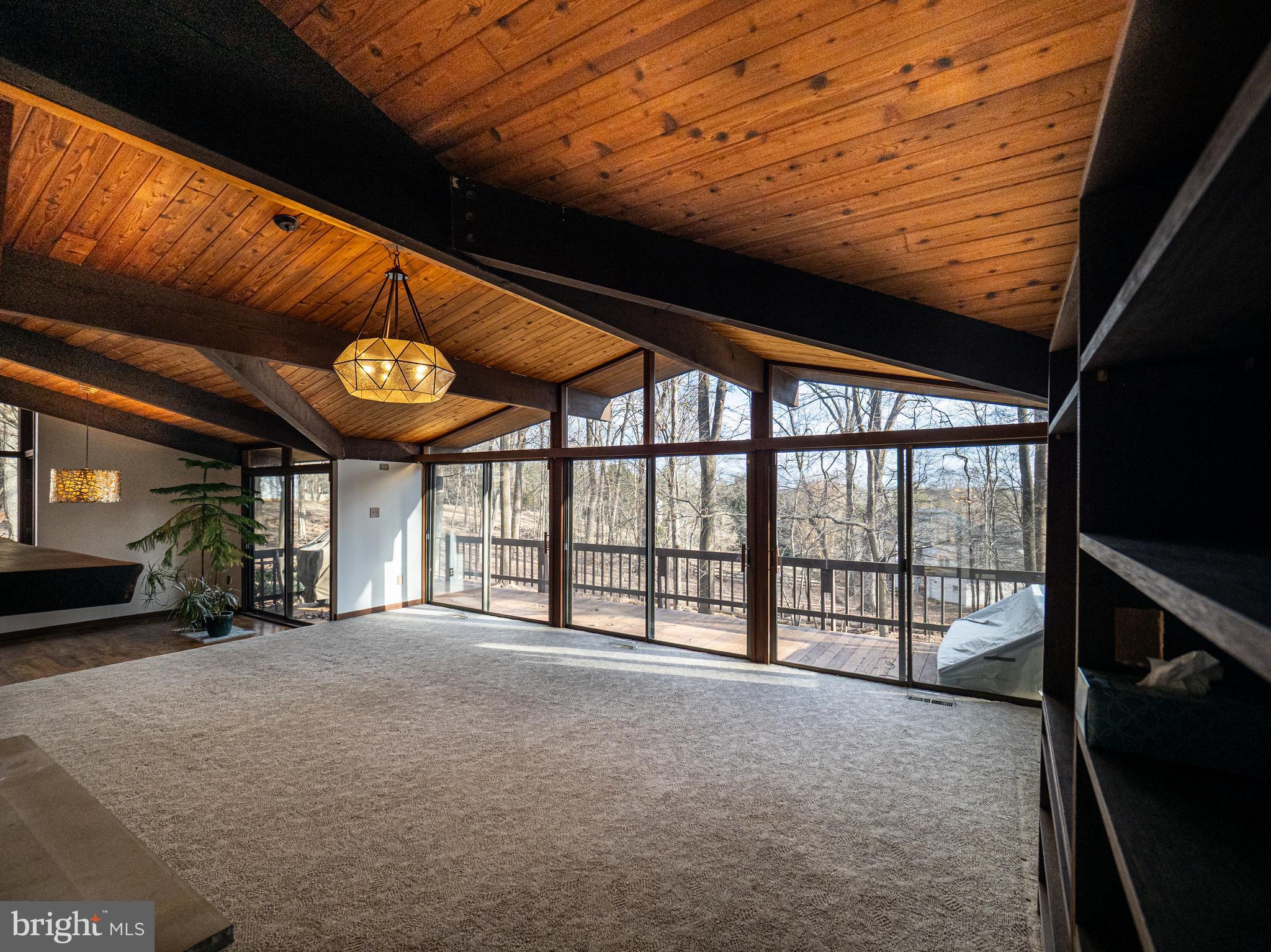 14805 Mockingbird Drive Darnestown, MD 20874 - Photo 5 of 35 a view of an empty room with a large window