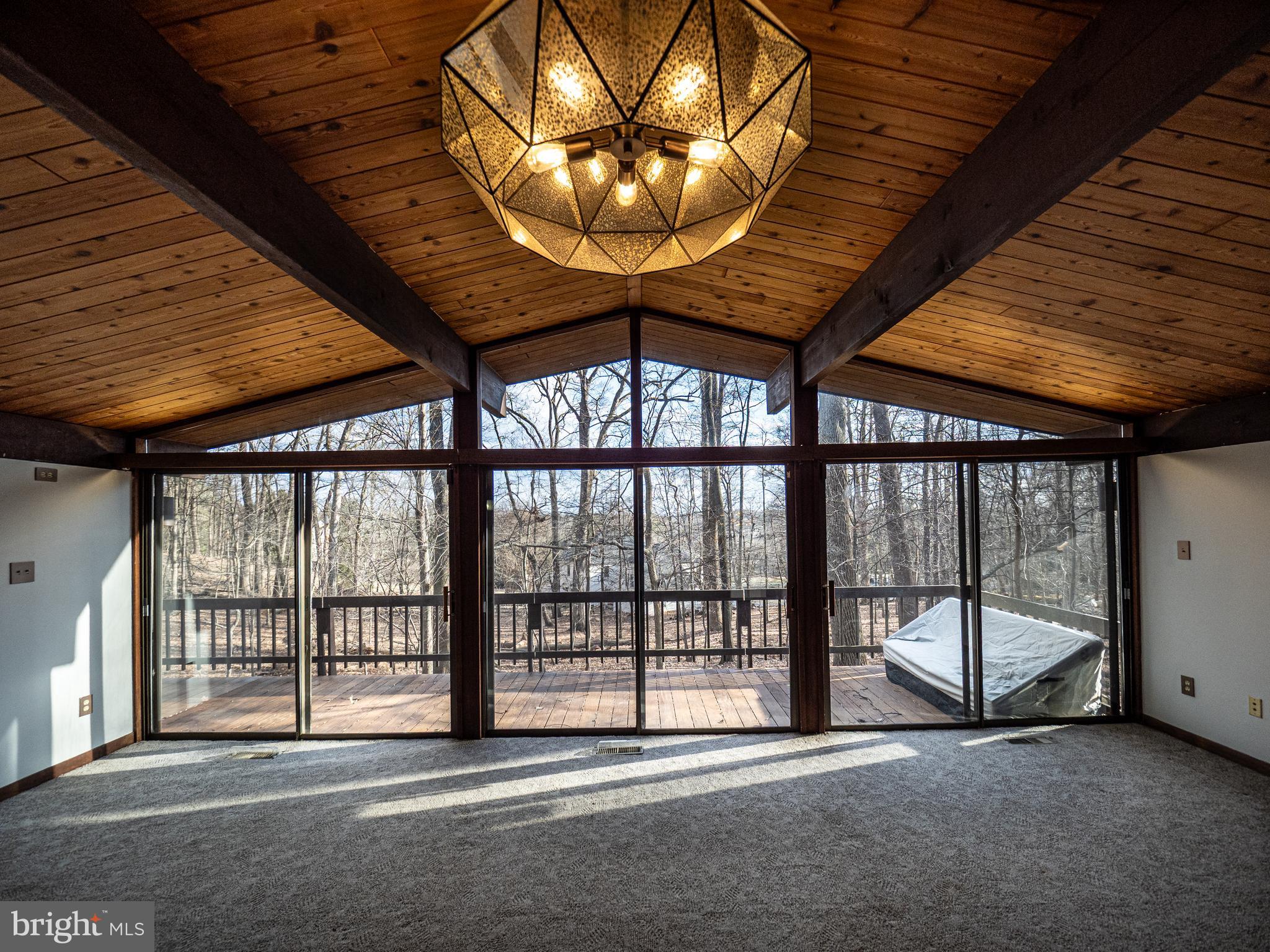14805 Mockingbird Drive Darnestown, MD 20874 - Photo 6 of 35 a view of an empty room with a chandelier
