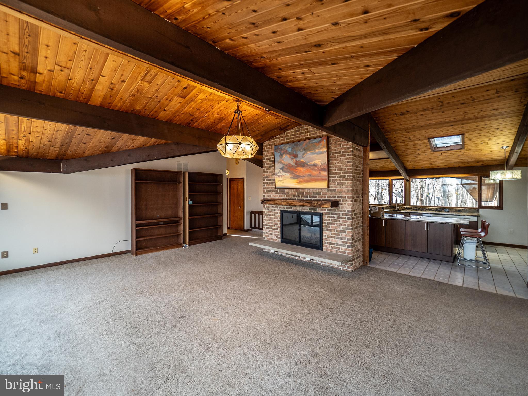 14805 Mockingbird Drive Darnestown, MD 20874 - Photo 8 of 35 a view of an empty room with a fireplace