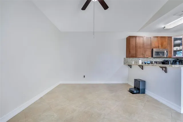 a kitchen with granite countertop a sink and a granite counter tops
