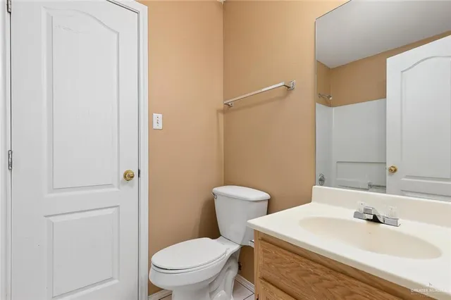 a bathroom with a sink toilet and vanity