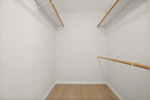 a white toilet sitting next to a bath tub