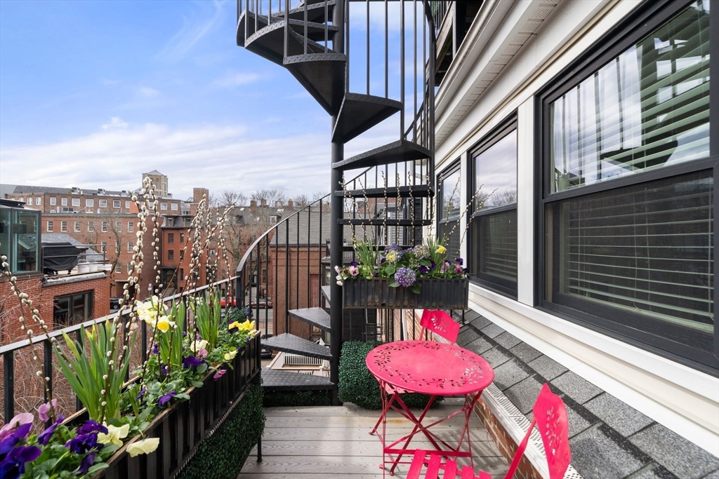 290 Shawmut Avenue, Unit 4 Boston, MA 02118 - Photo 16 of 28 a view of a balcony with wooden floor