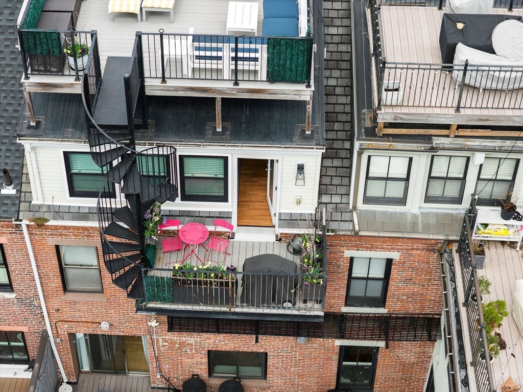 290 Shawmut Avenue, Unit 4 Boston, MA 02118 - Photo 19 of 28 a front view of a building with balcony and outdoor seating