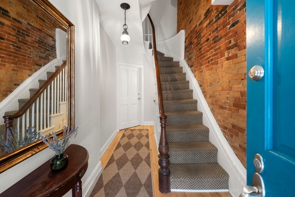 290 Shawmut Avenue, Unit 4 Boston, MA 02118 - Photo 25 of 28 a view of staircase with wooden floor and white walls