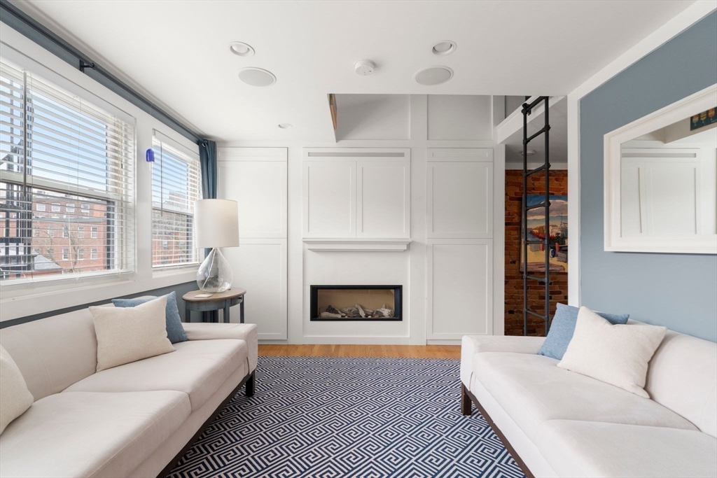 290 Shawmut Avenue, Unit 4 Boston, MA 02118 - Photo 3 of 28 a living room with furniture fireplace and window
