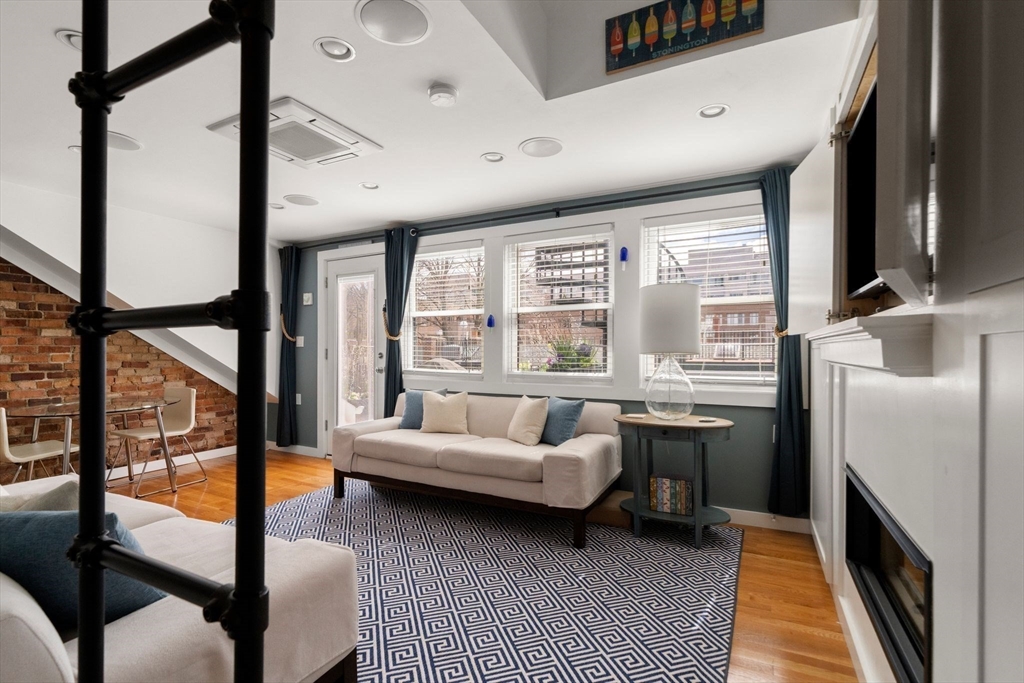 290 Shawmut Avenue, Unit 4 Boston, MA 02118 - Photo 6 of 28 a living room with furniture and a floor to ceiling window