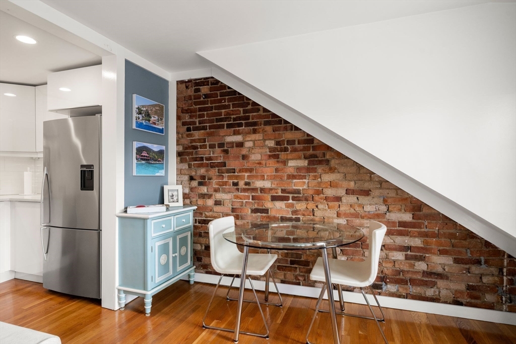 290 Shawmut Avenue, Unit 4 Boston, MA 02118 - Photo 7 of 28 a view of kitchen with furniture and a refrigerator
