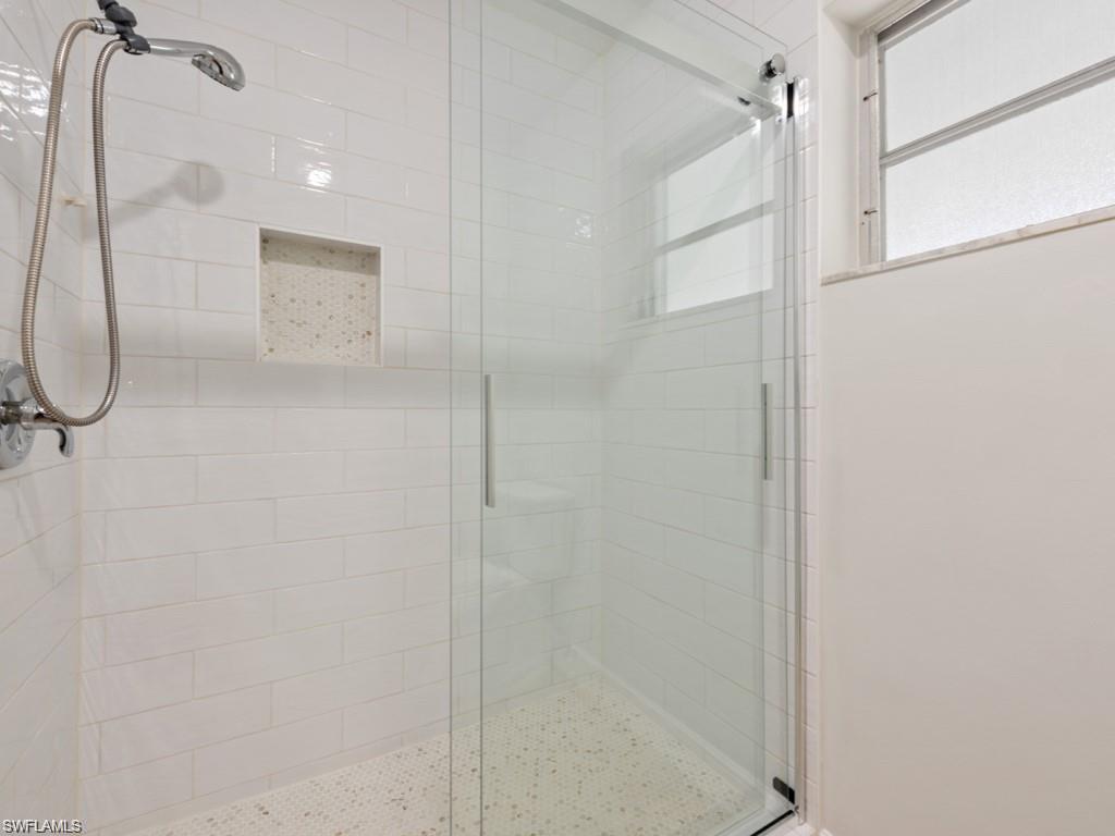945 Sundrop Court Marco Island, FL 34145 - Photo 12 of 31 a bathroom with a shower