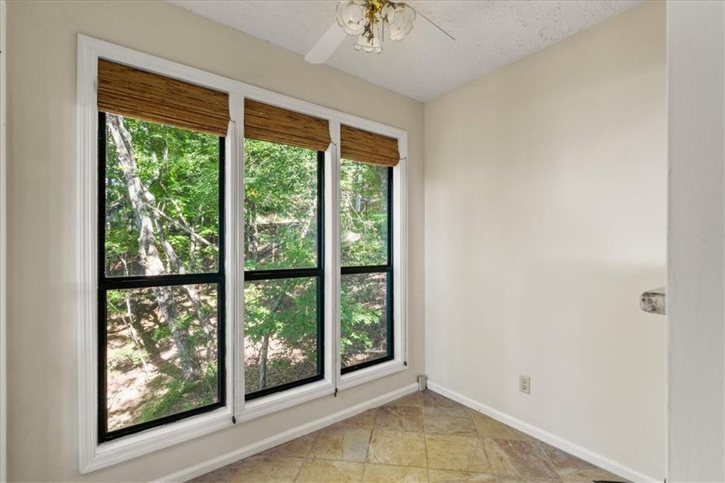 157 Sunrise Terrace Jasper, GA 30143 - Photo 15 of 54 a view of an empty room with wooden floor and a window