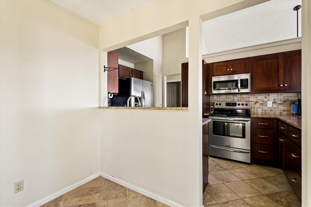 157 Sunrise Terrace Jasper, GA 30143 - Photo 17 of 54 a kitchen with granite countertop a refrigerator and a stove top oven
