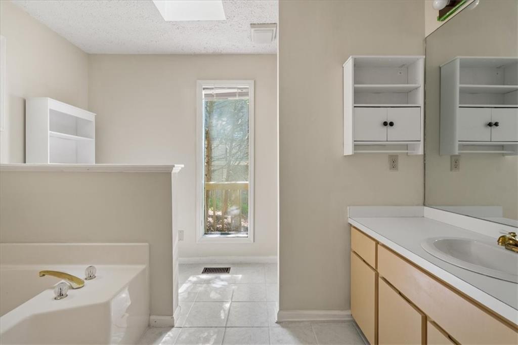 157 Sunrise Terrace Jasper, GA 30143 - Photo 22 of 54 a bathroom with a sink a bathtub and a shower