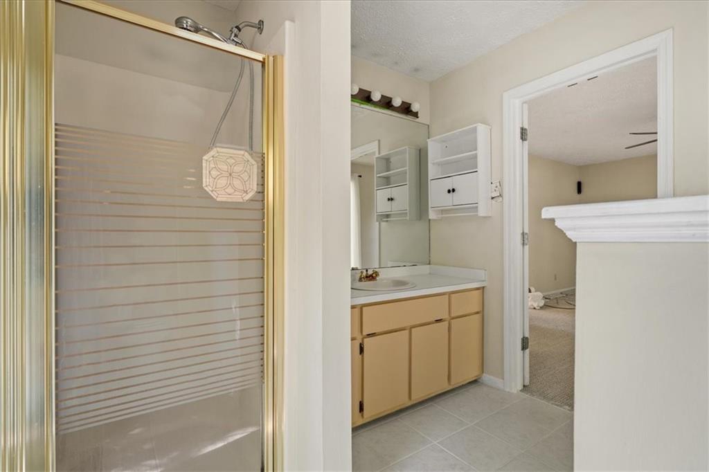 157 Sunrise Terrace Jasper, GA 30143 - Photo 25 of 54 a bathroom with a granite countertop sink a toilet and shower