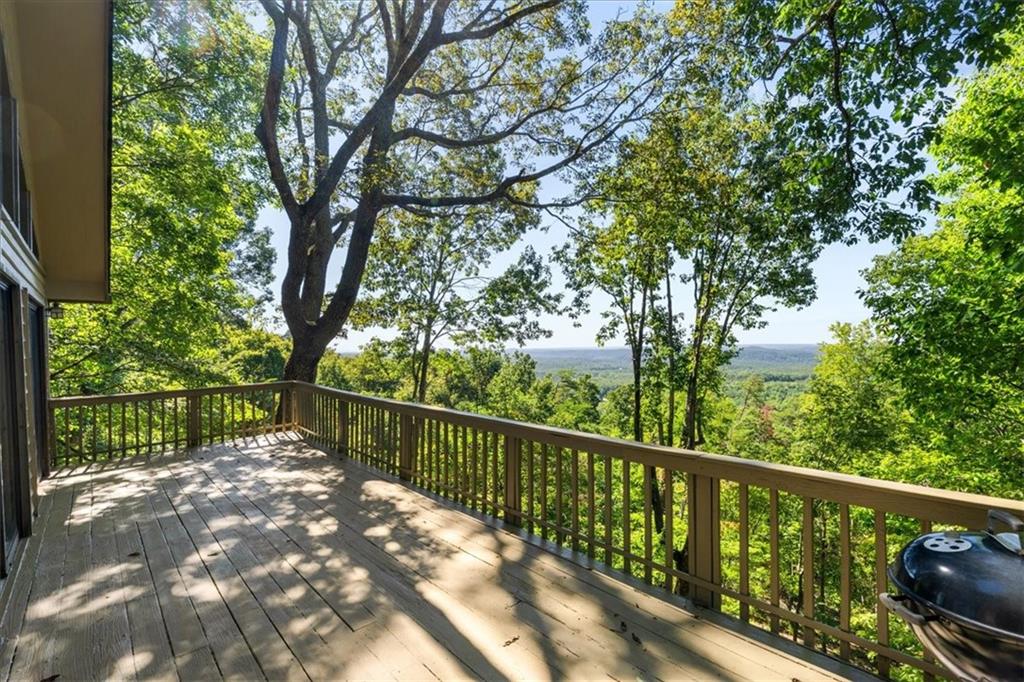 157 Sunrise Terrace Jasper, GA 30143 - Photo 26 of 54 a balcony with trees in front of it