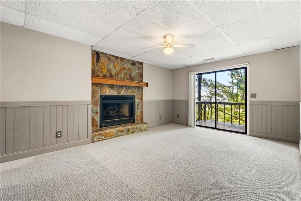 157 Sunrise Terrace Jasper, GA 30143 - Photo 28 of 54 an empty room with windows fireplace and fan