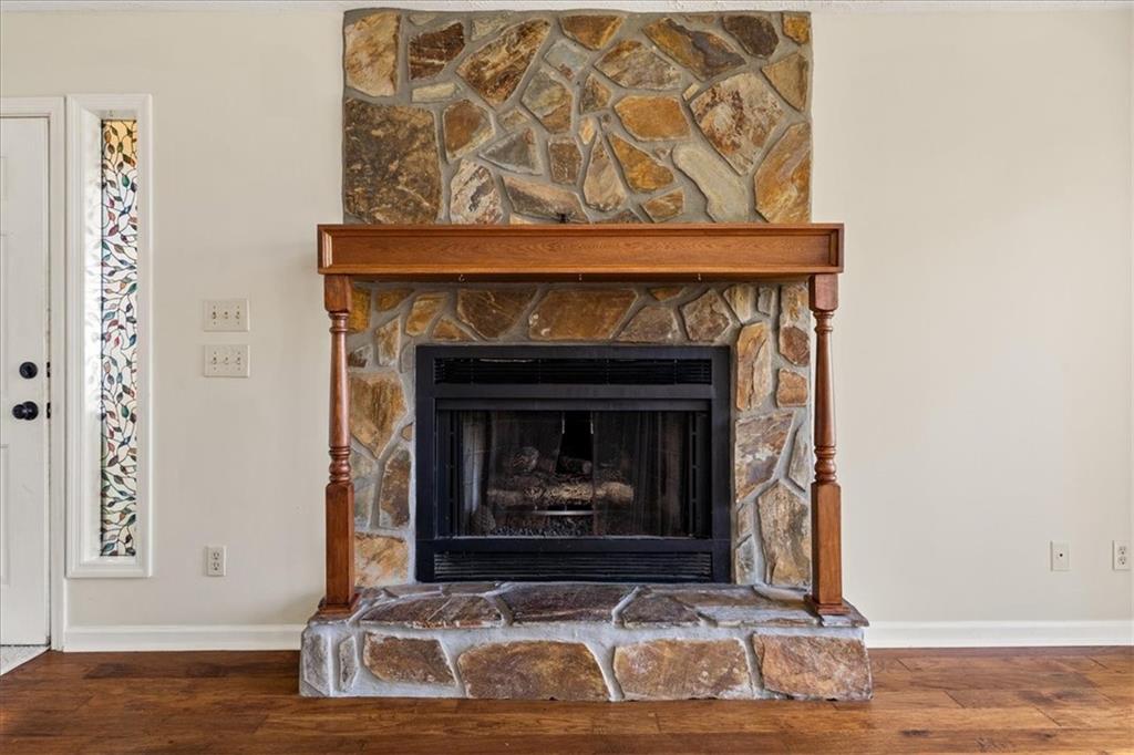 157 Sunrise Terrace Jasper, GA 30143 - Photo 5 of 54 a living room with a fireplace and a wooden floor