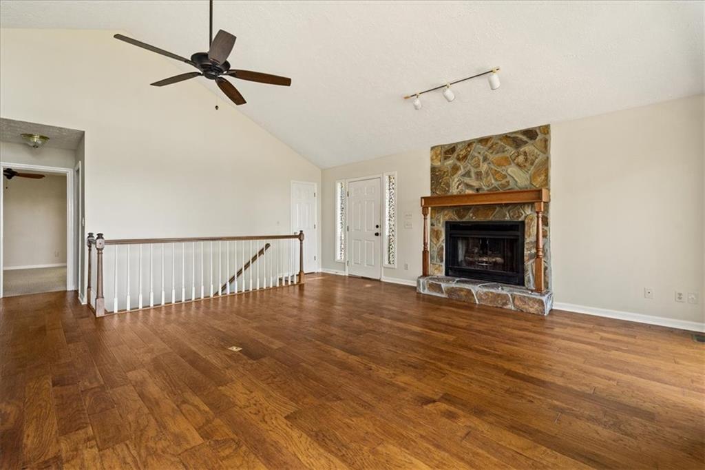 157 Sunrise Terrace Jasper, GA 30143 - Photo 6 of 54 a view of empty room with wooden floor and fireplace
