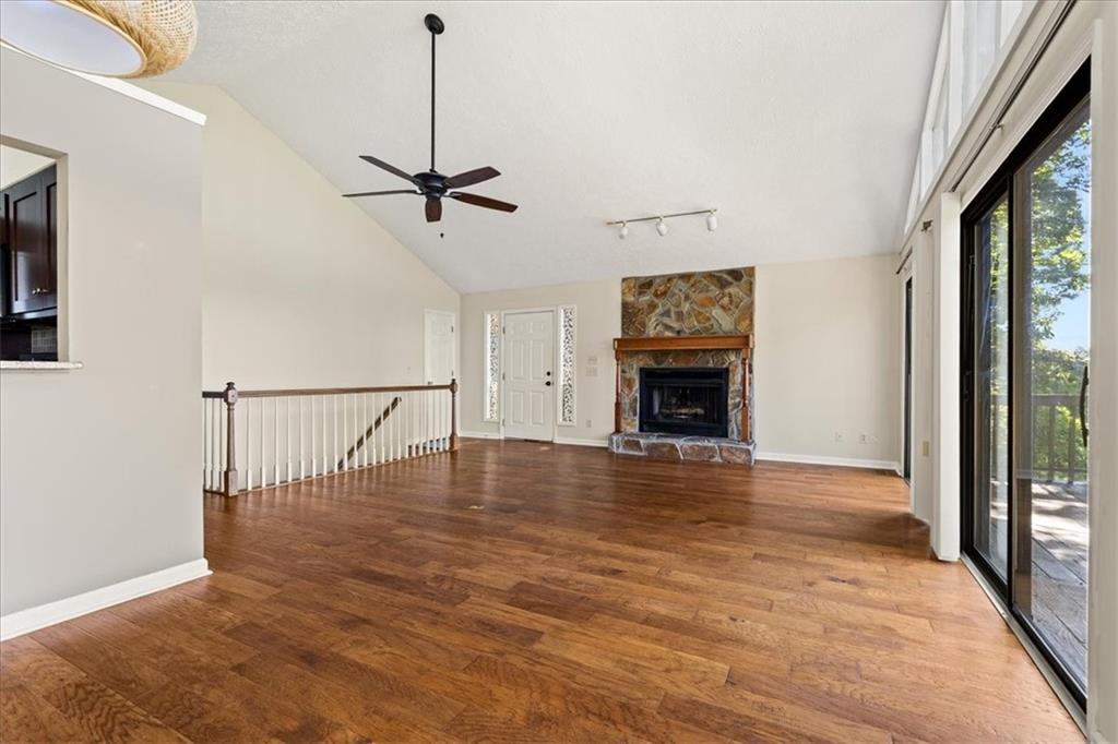 157 Sunrise Terrace Jasper, GA 30143 - Photo 7 of 54 a view of empty room with wooden floor and fireplace