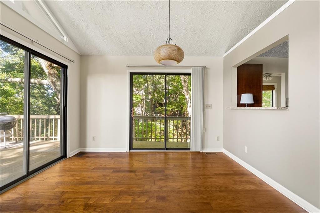 157 Sunrise Terrace Jasper, GA 30143 - Photo 8 of 54 a view of an empty room with wooden floor and a window