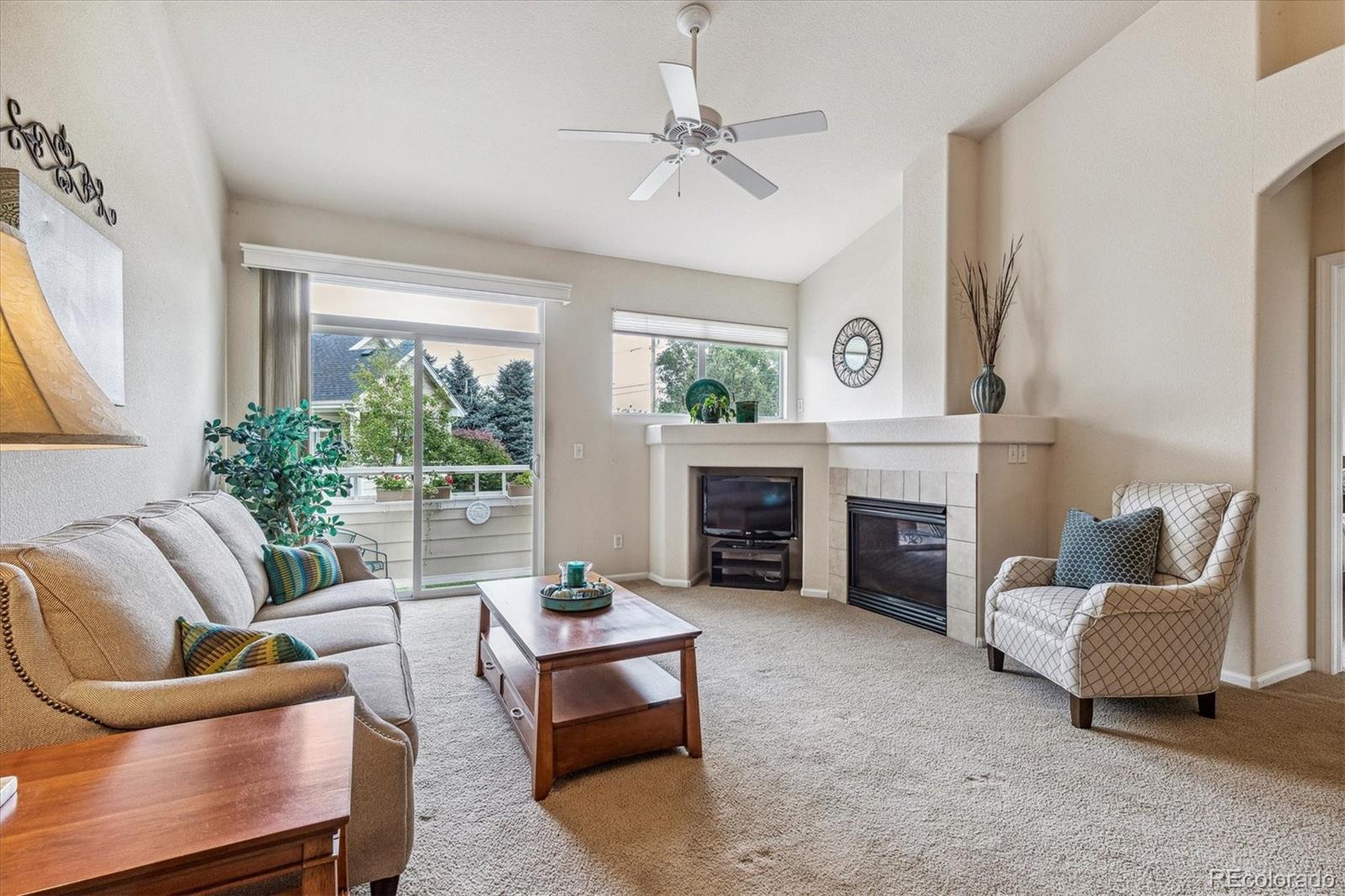 6596 South Reed Way, Unit B Littleton, CO 80123 - Photo 6 of 22 a living room with furniture and a fireplace