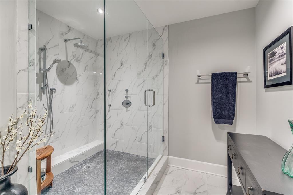 1505 Elm Street, Unit 1504 Dallas, TX 75201 - Photo 18 of 33 Full bath featuring vanity, light marble finish floors, and a marble finish shower