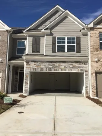 a front view of a house with a garage