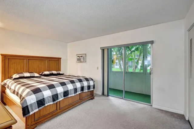 a bedroom with a bed and with a window