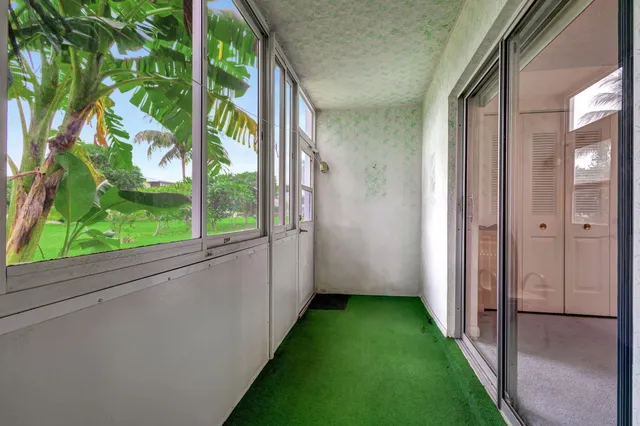 a view of a porch with a yard