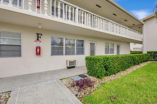 a view of a building with potted plants