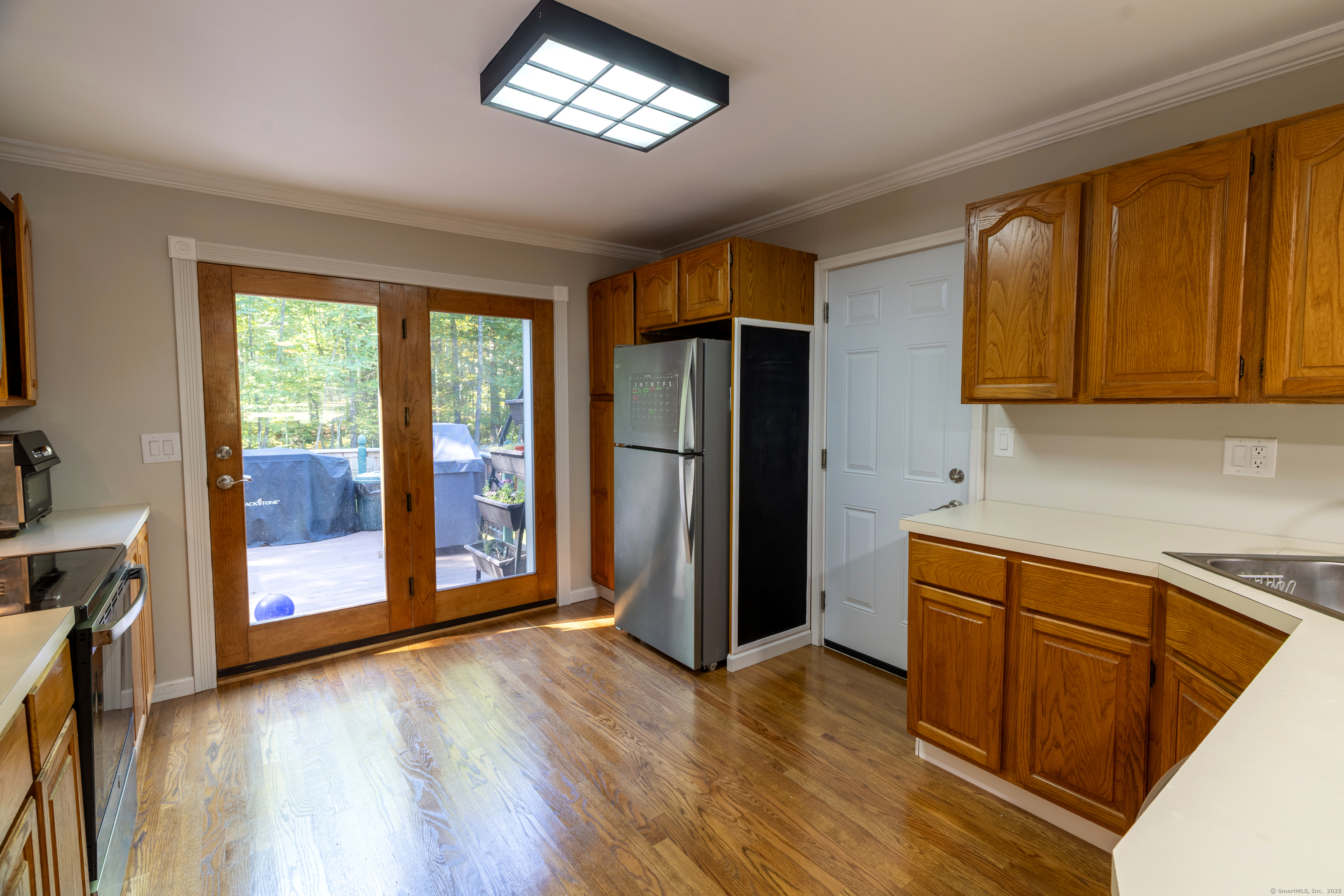 48 Quailcrest Road East Lyme, CT 06333 - Photo 14 of 31 a kitchen with stainless steel appliances granite countertop a refrigerator and a stove top oven