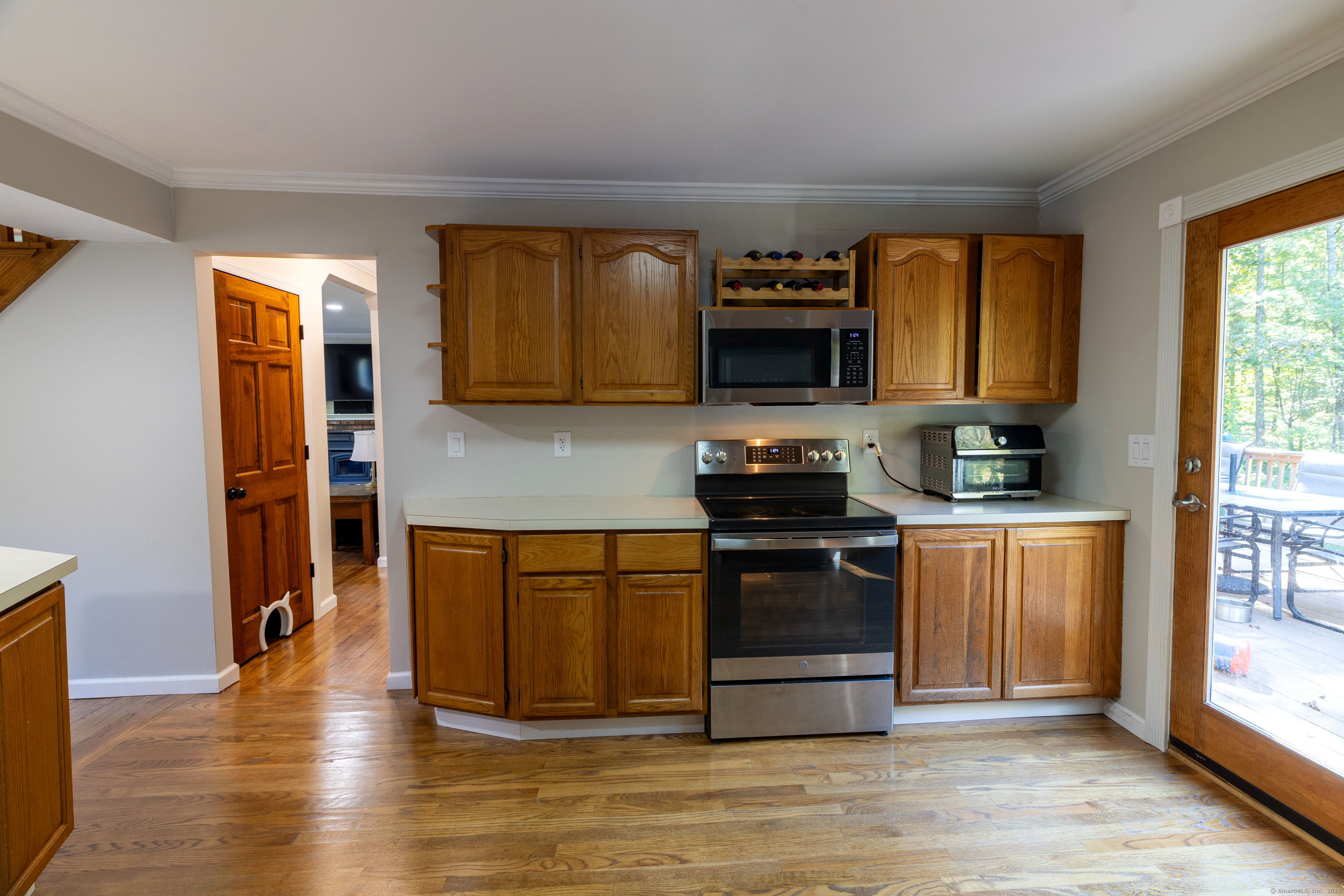 48 Quailcrest Road East Lyme, CT 06333 - Photo 15 of 31 a kitchen with stainless steel appliances granite countertop a stove a sink and a refrigerator