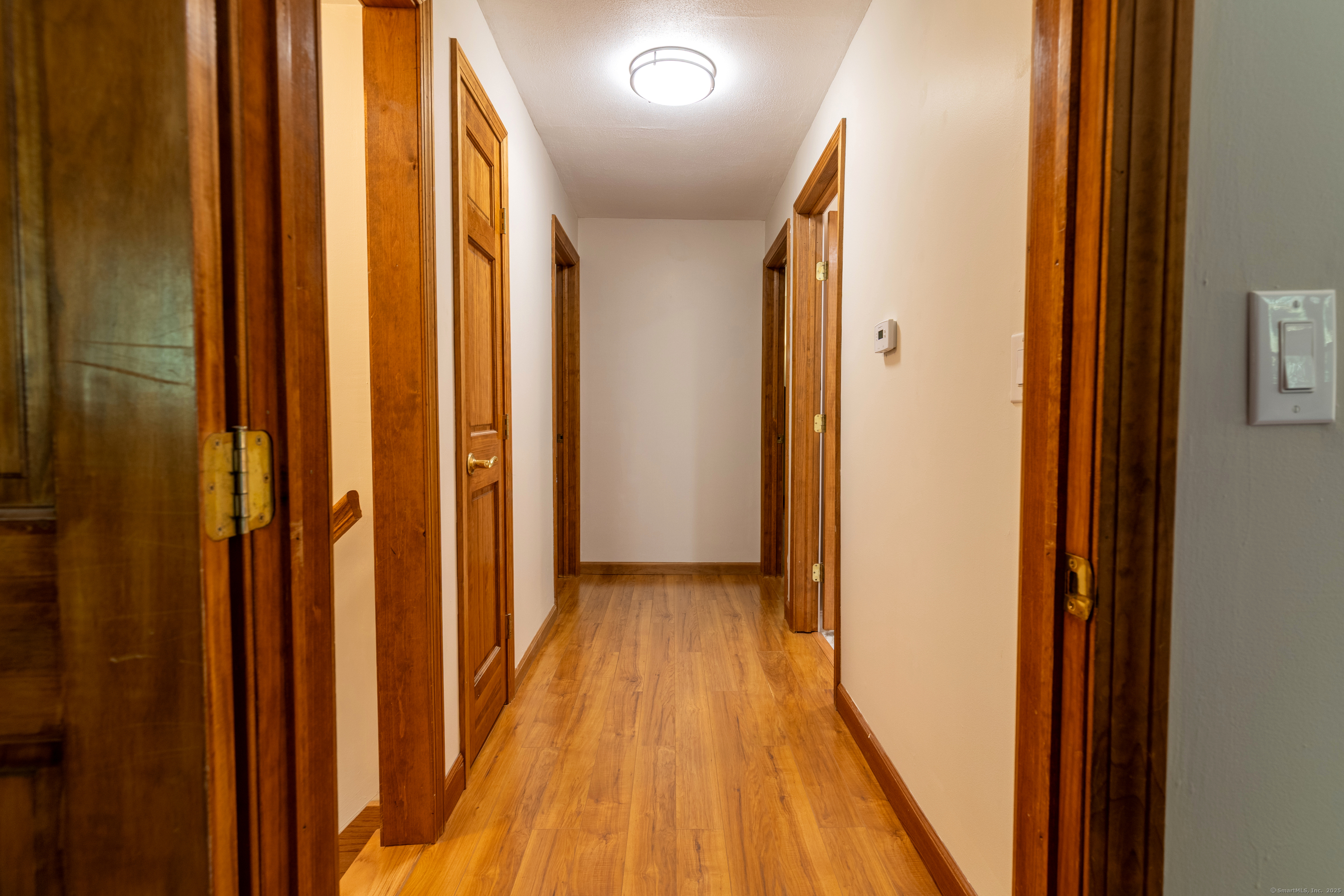 48 Quailcrest Road East Lyme, CT 06333 - Photo 17 of 31 a view of a hallway with wooden floor