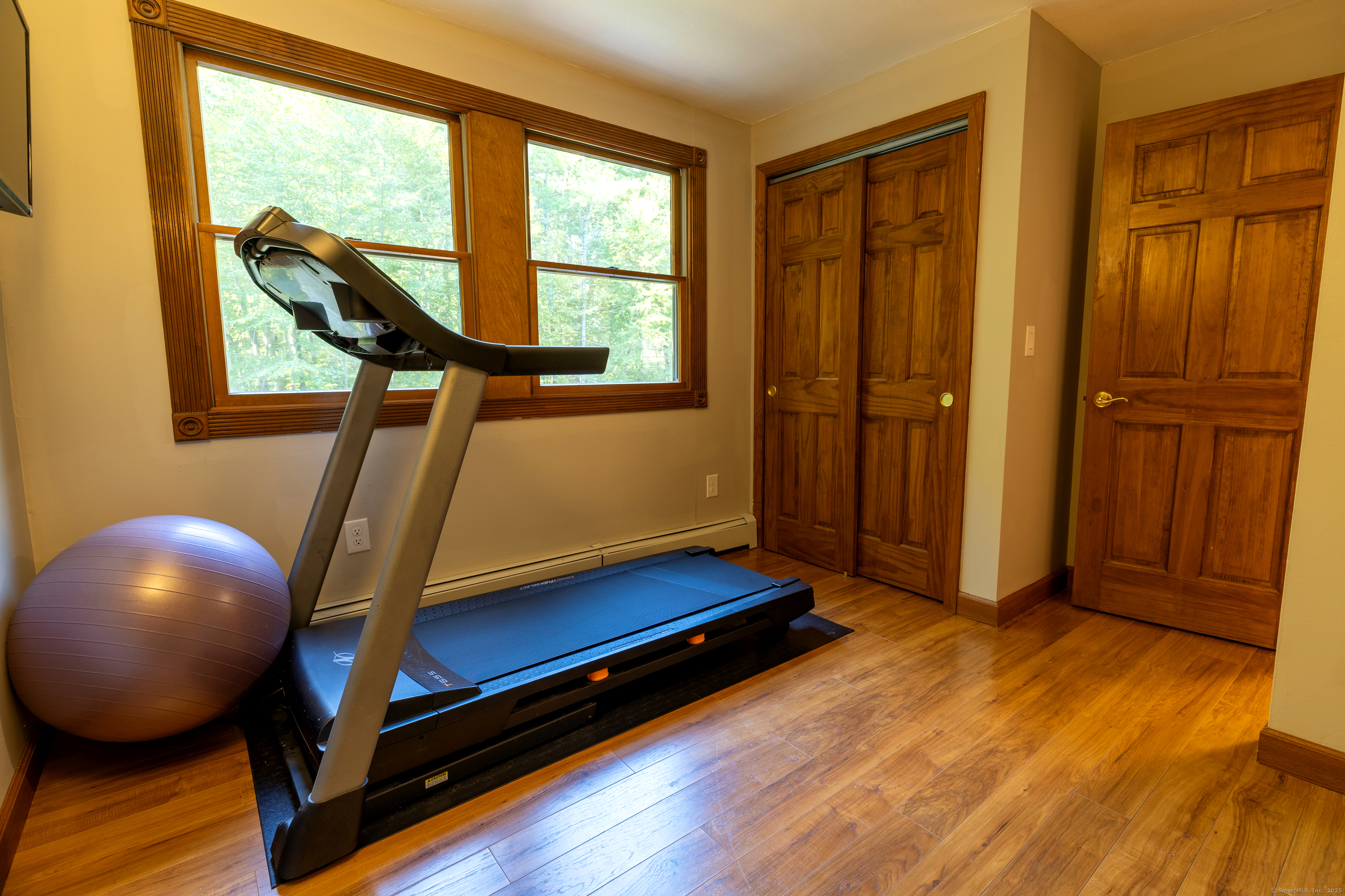 48 Quailcrest Road East Lyme, CT 06333 - Photo 19 of 31 a room with wooden floor and windows