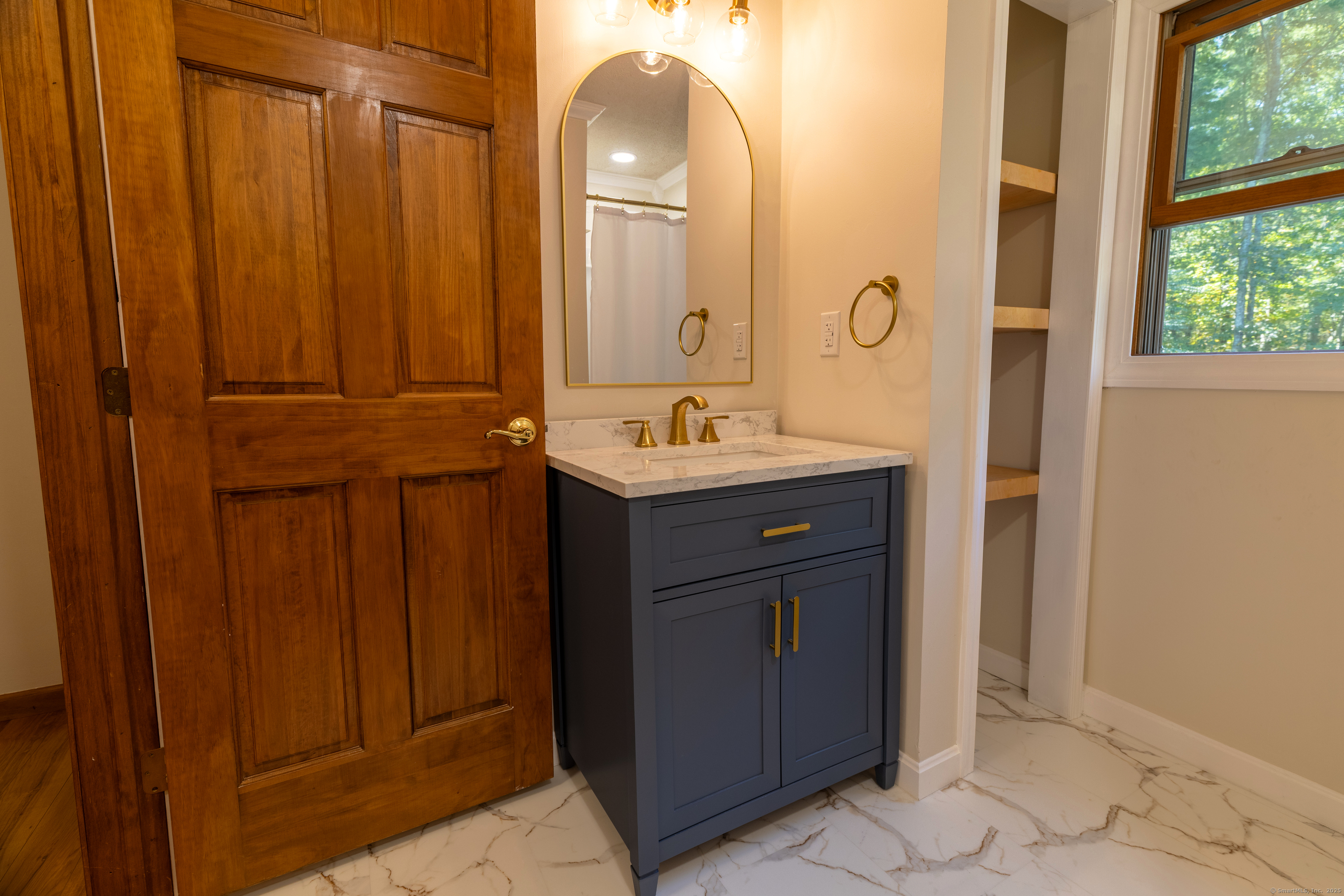48 Quailcrest Road East Lyme, CT 06333 - Photo 20 of 31 a bathroom with a sink and a mirror