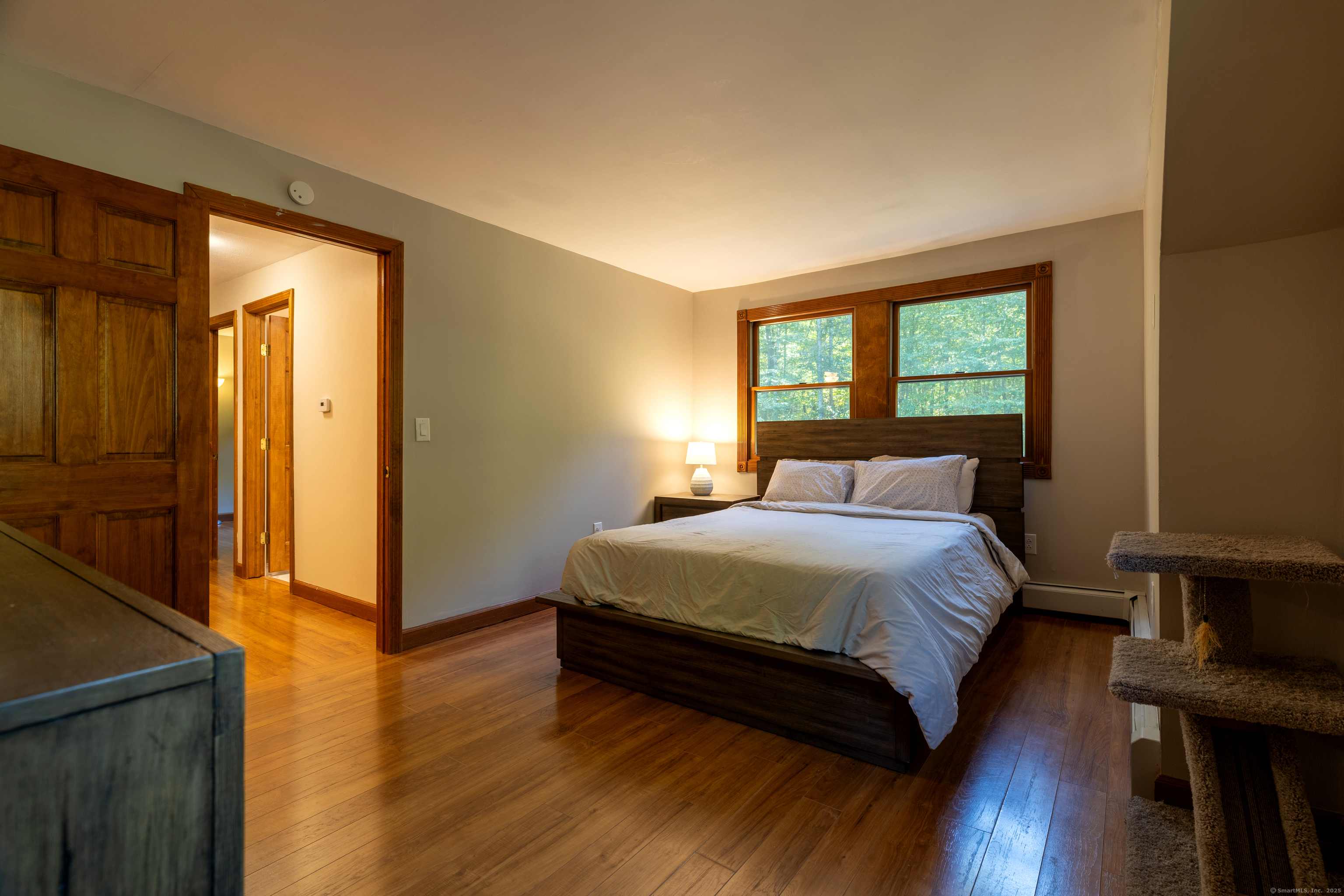 48 Quailcrest Road East Lyme, CT 06333 - Photo 23 of 31 a bedroom with a bed and wooden floor