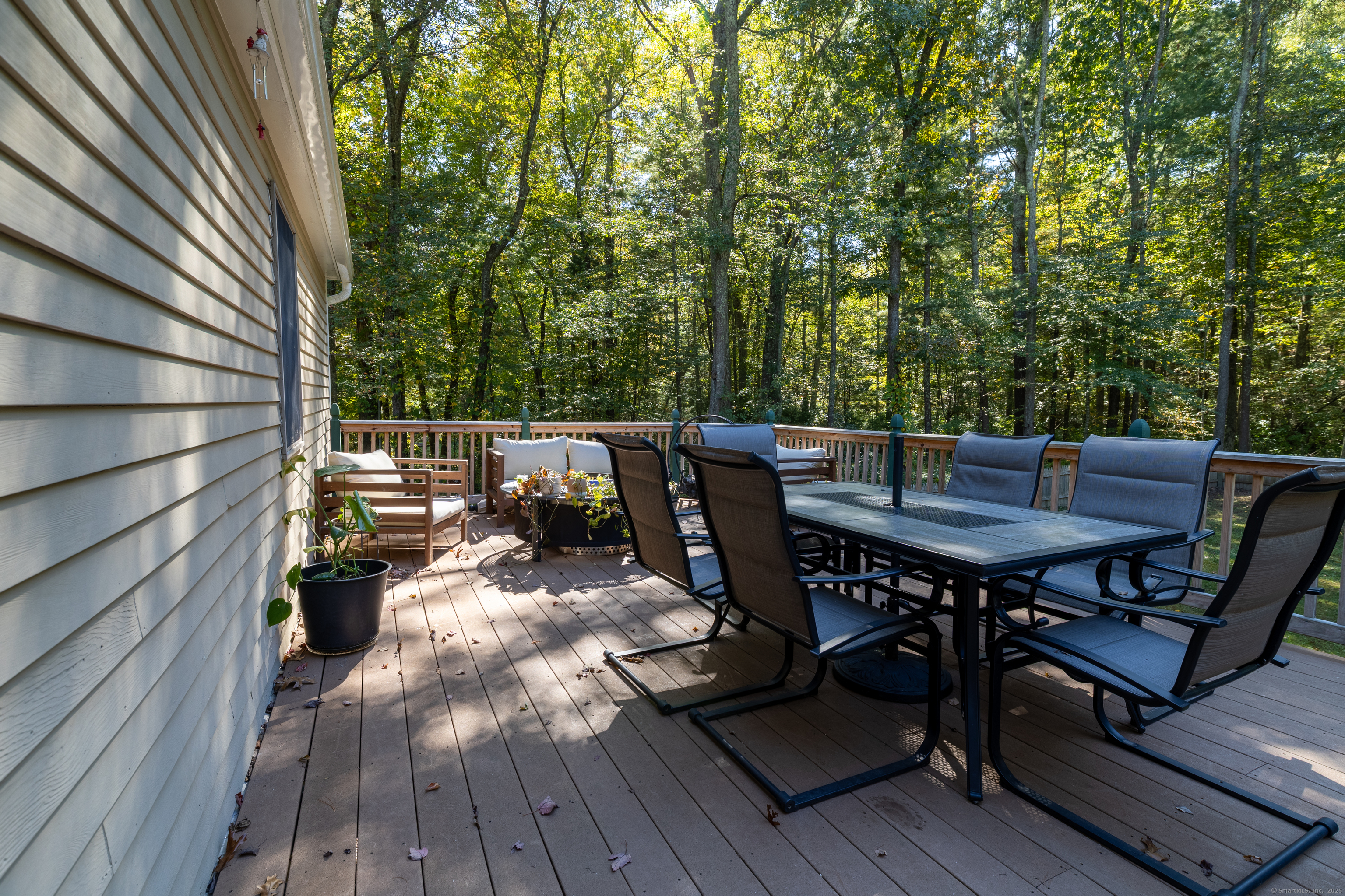 48 Quailcrest Road East Lyme, CT 06333 - Photo 26 of 31 a view of a chairs and table on the deck