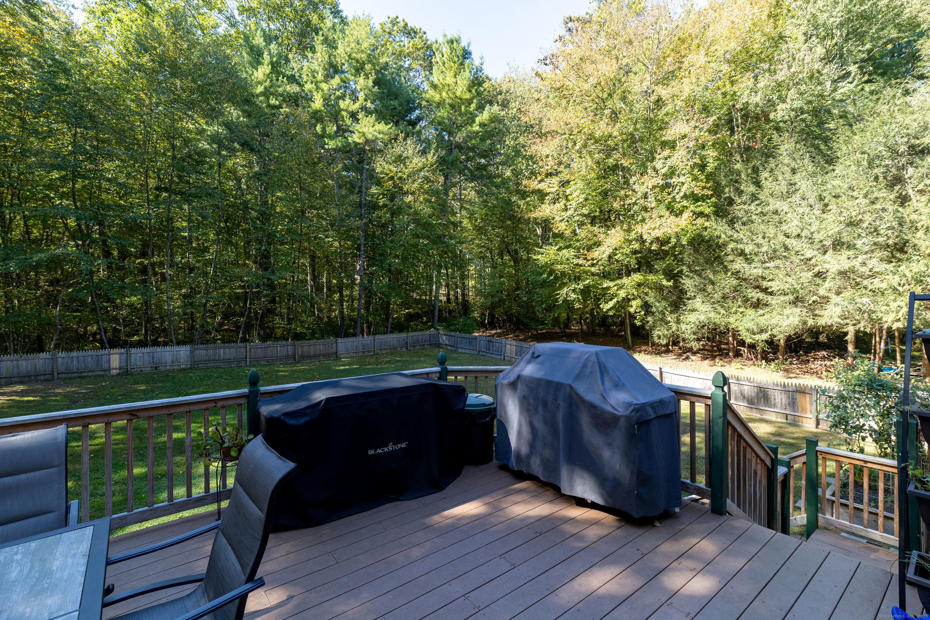 48 Quailcrest Road East Lyme, CT 06333 - Photo 27 of 31 a backyard of a house with wooden floor and outdoor seating