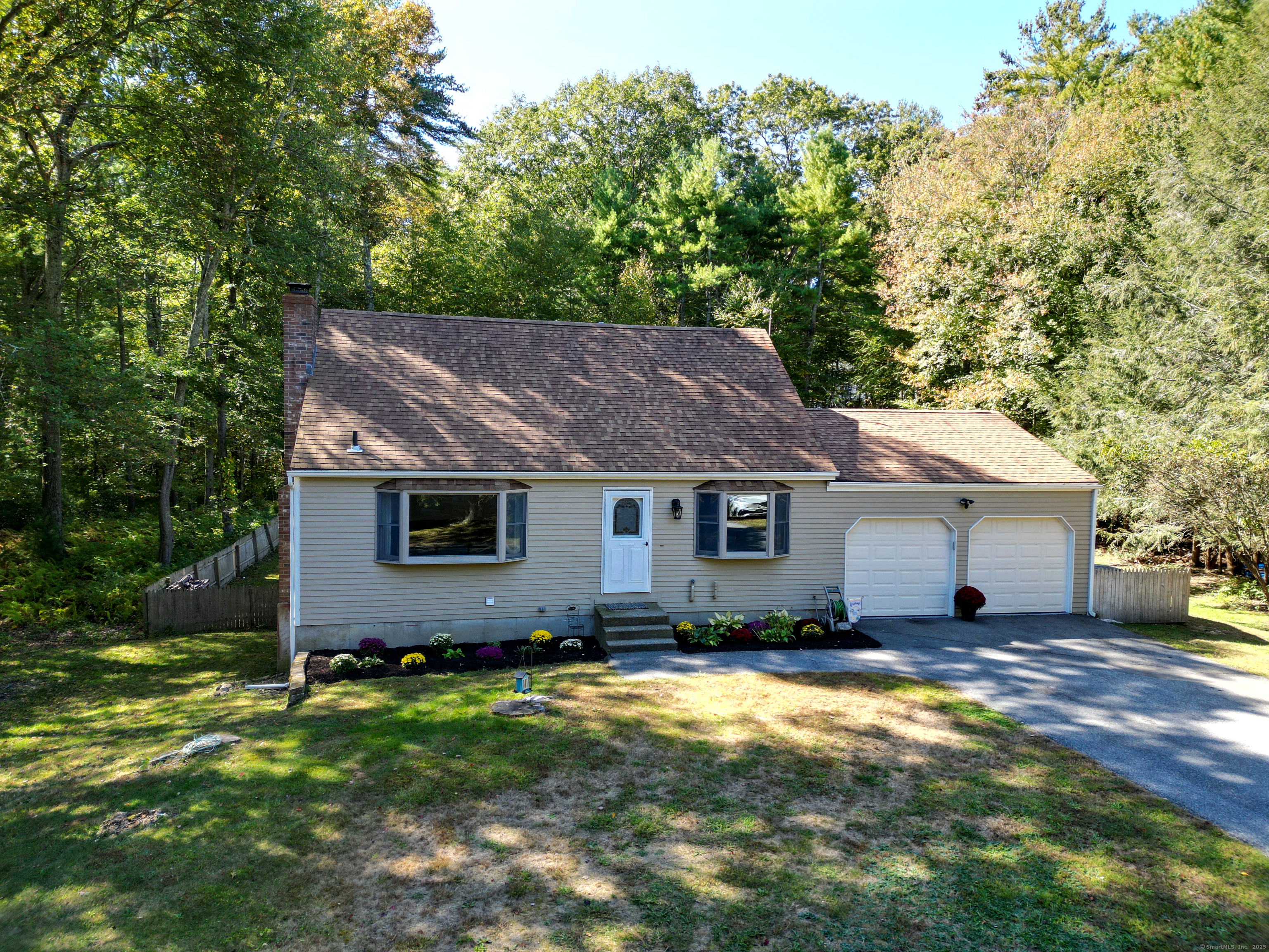 48 Quailcrest Road East Lyme, CT 06333 - Photo 3 of 31 a backyard of a house with yard and outdoor seating