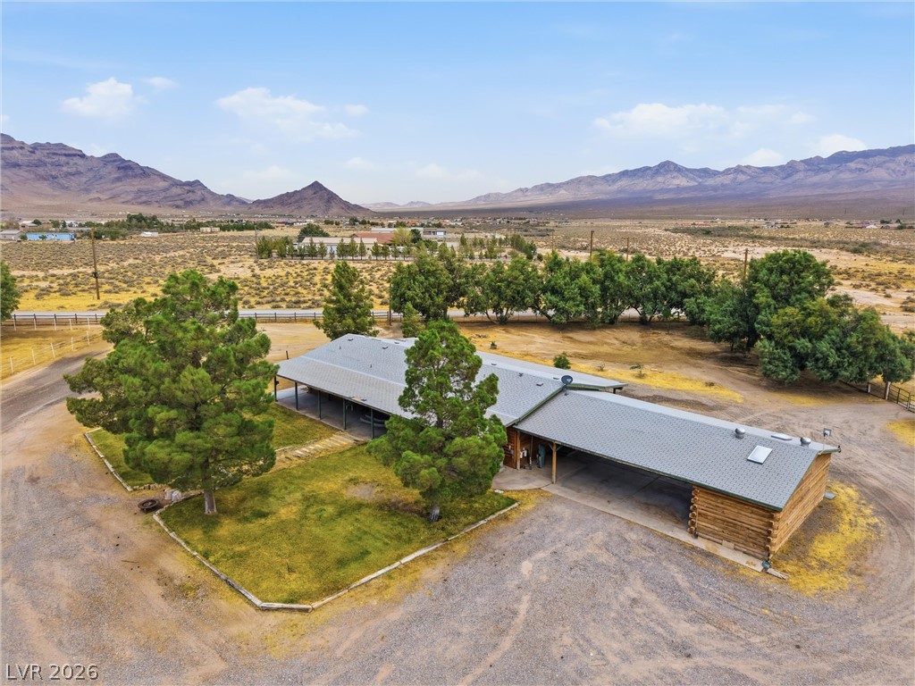 1531 West Harris Farm Road Pahrump, NV 89060 - Photo 6 of 37 Discover a tranquil retreat nestled amidst a sprawling desert landscape with majestic mountain views.