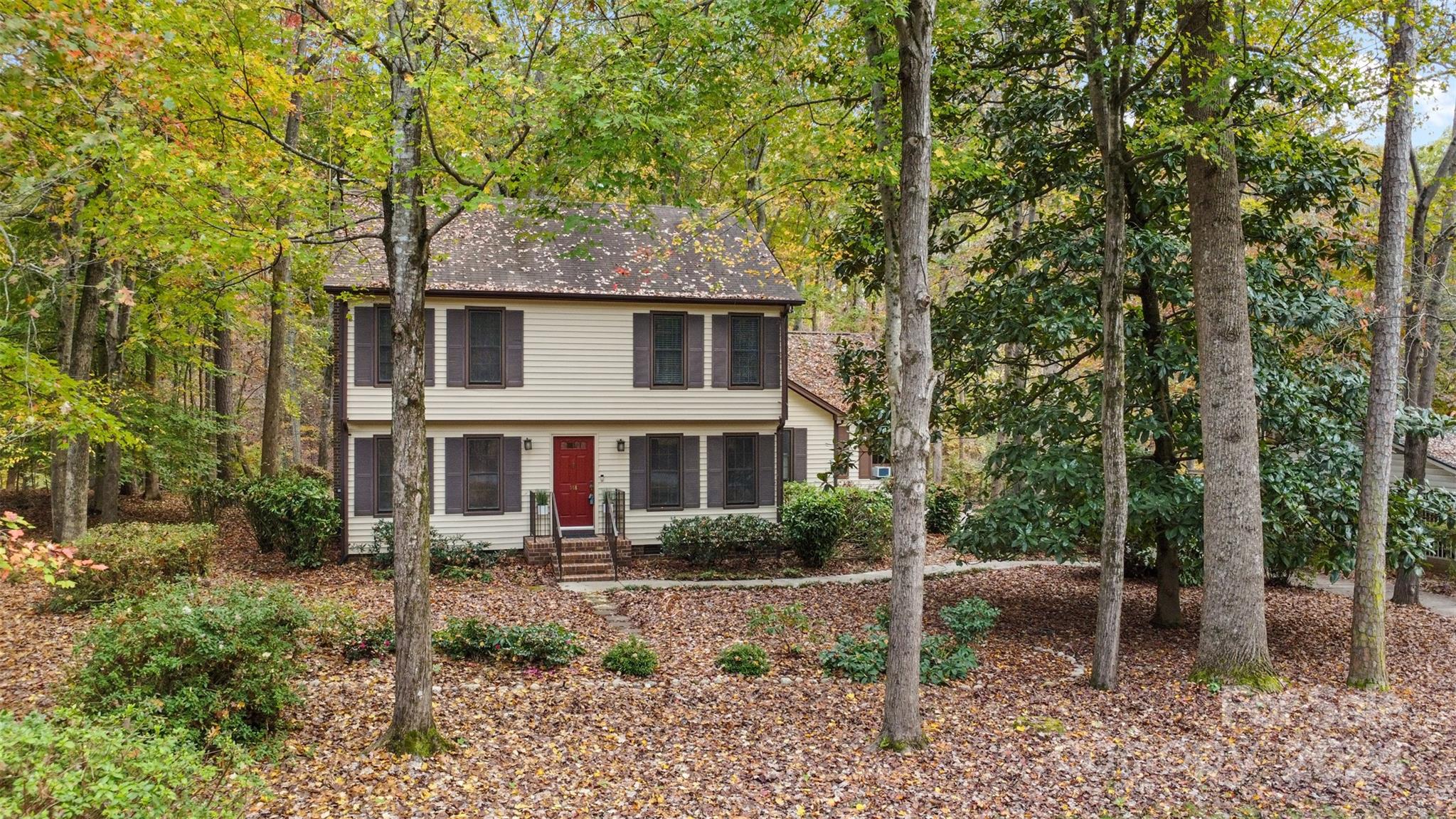 348 Beverly Circle Charlotte, NC 28270 - Photo 2 of 45 a front view of a house with a garden
