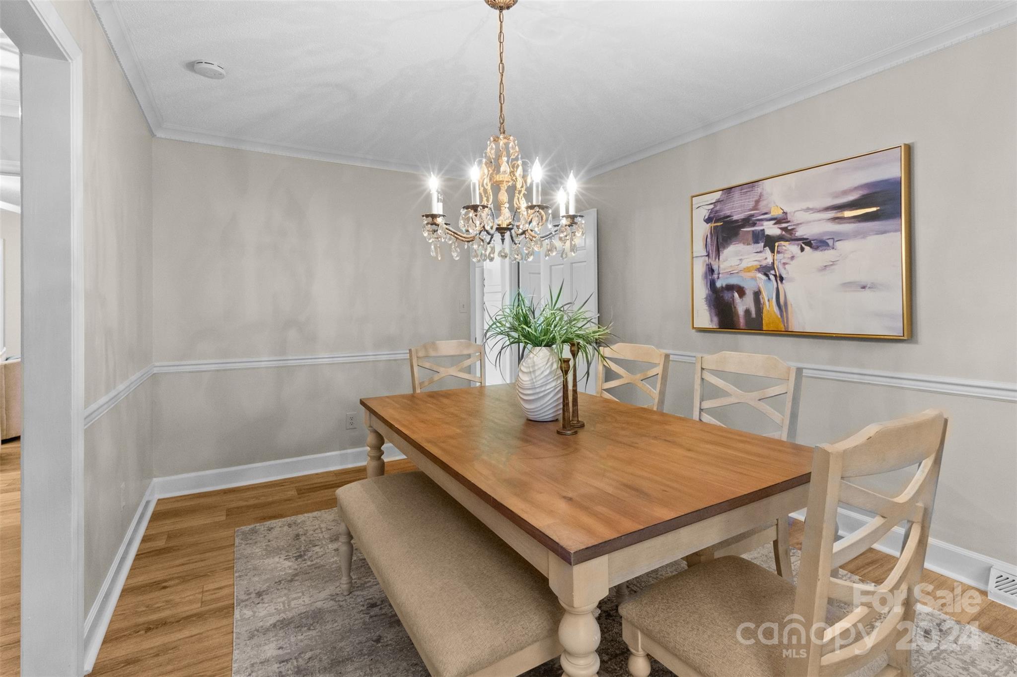 348 Beverly Circle Charlotte, NC 28270 - Photo 5 of 45 a dining room with furniture and chandelier
