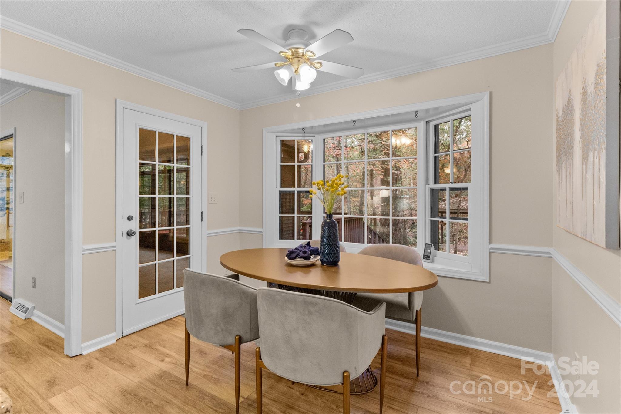 348 Beverly Circle Charlotte, NC 28270 - Photo 9 of 45 a dining room with furniture a chandelier and wooden floor