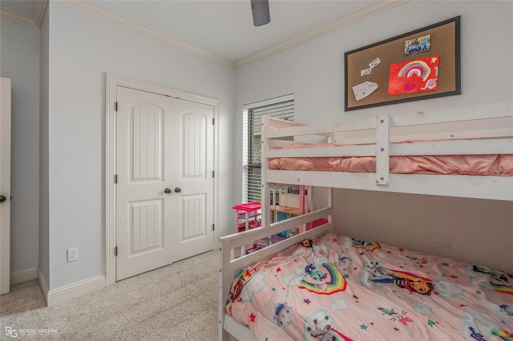 711 Reeds Reef Bossier City, LA 71112 - Photo 28 of 36 a bedroom with bed and paintings on the wall