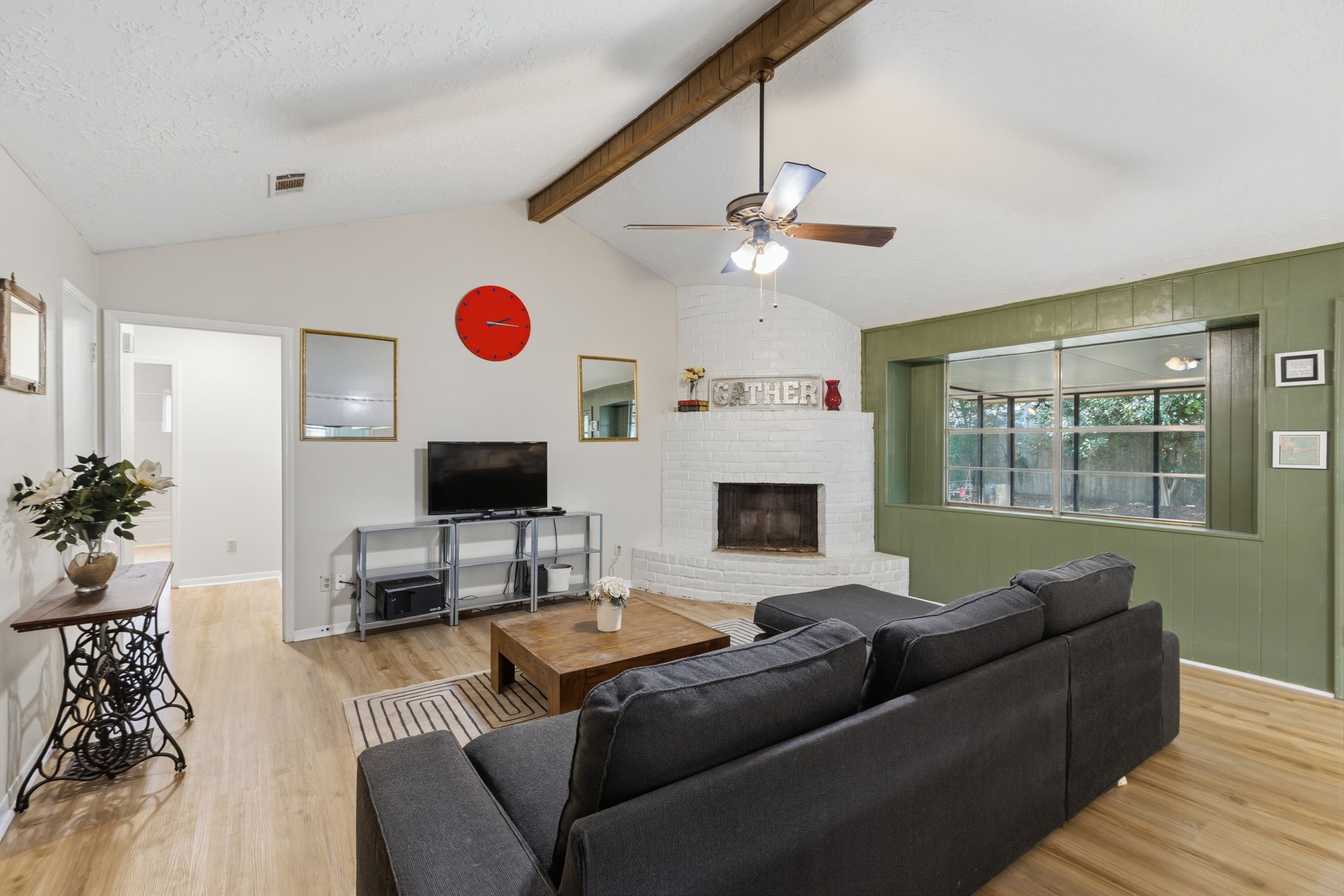 9618 Rannock Way Spring, TX 77379 - Photo 7 of 24 a living room with furniture a fireplace and a flat screen tv