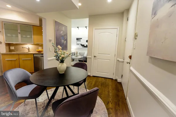 a dining room with furniture and window