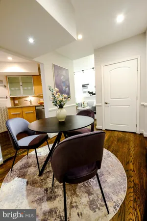 a very nice looking dining room with a table and chairs