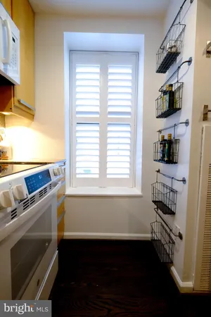 a kitchen with a sink and a window